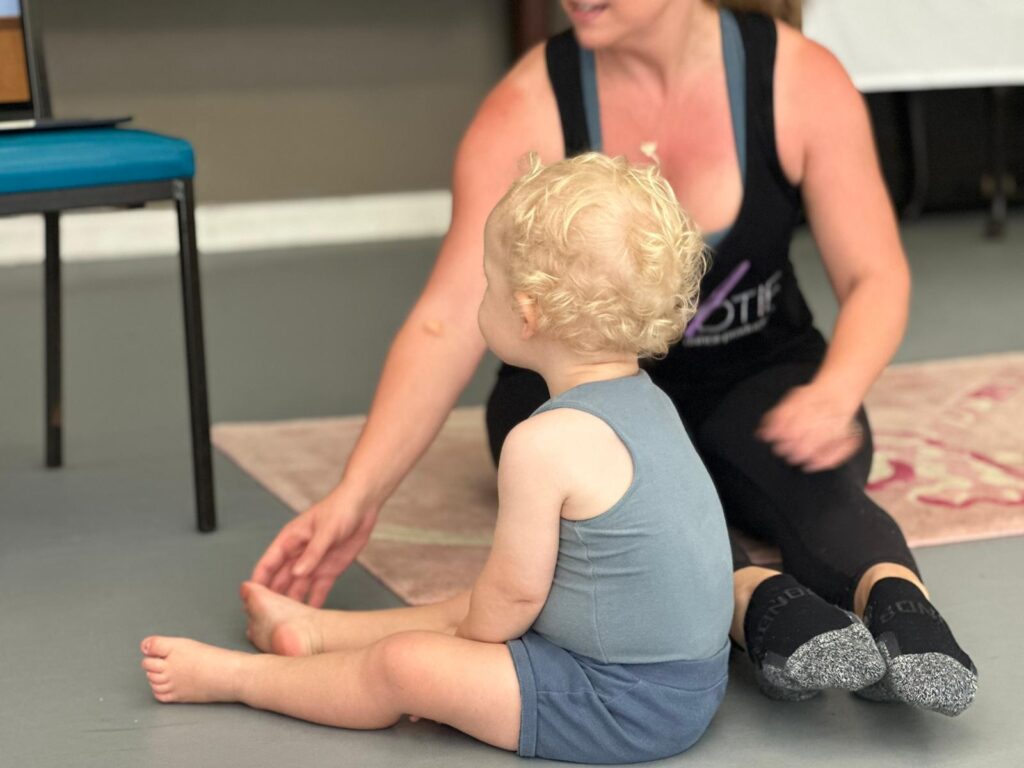 dance teacher and child learning to pose