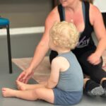 dance teacher and child learning to pose